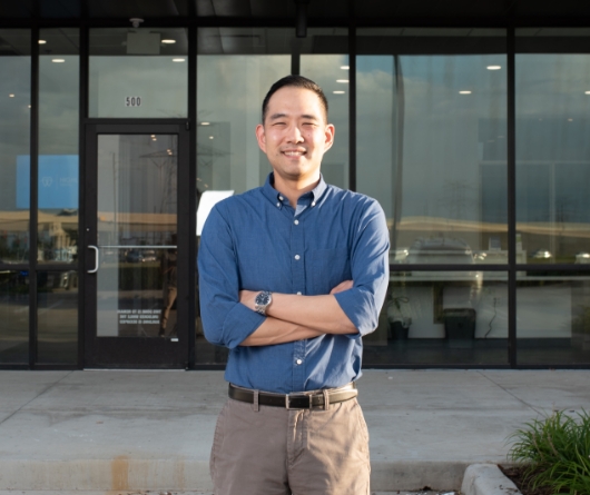 Doctor Kim standing in front of Highline Dental