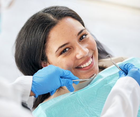 Young woman getting her dental checkup