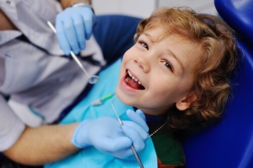 Young child smiling in dental chair