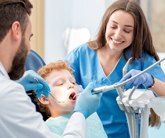 Young boy getting a dental checkup and cleaning