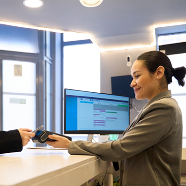 Dental patient paying for their treatment