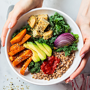 Holding a bowl of salad
