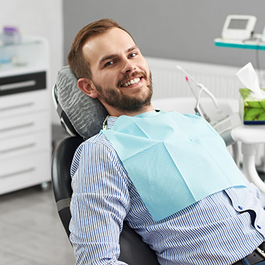 Young man leaning back in the dental chair