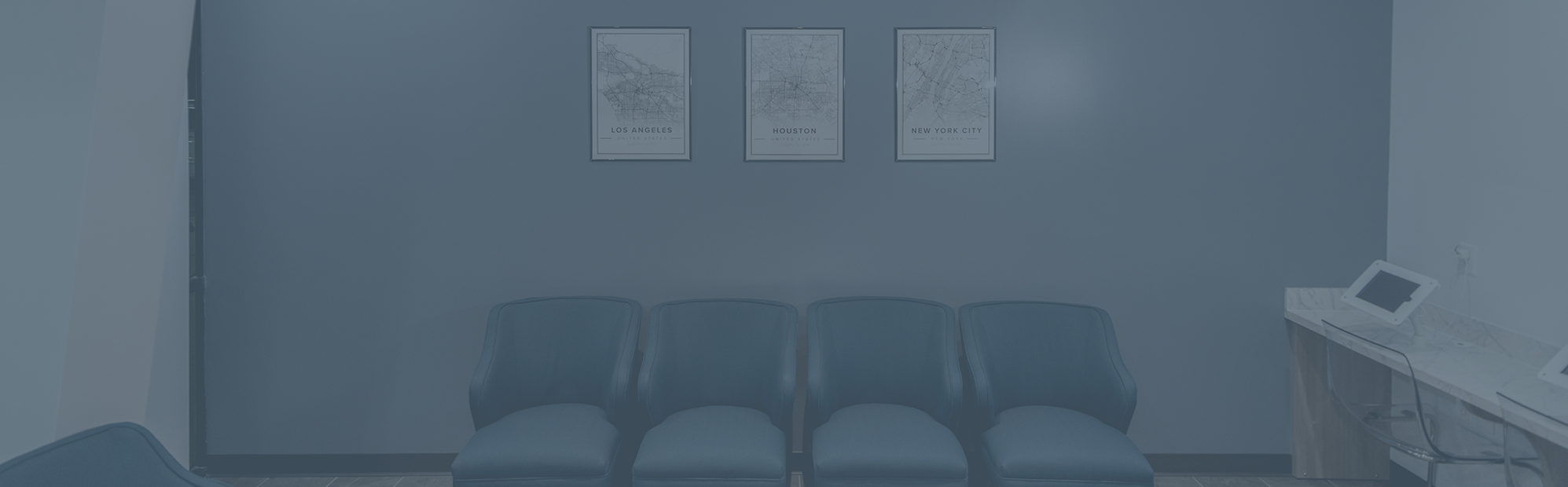 Row of blue chairs in the waiting area at Highline Dental