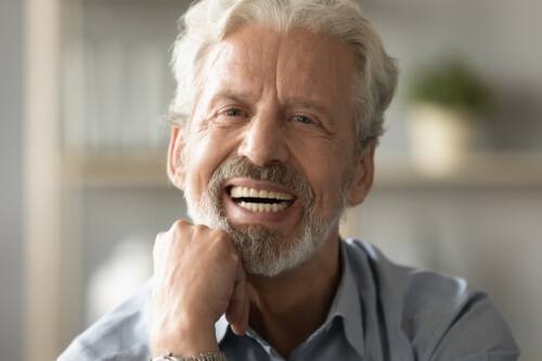 Smiling man with gray hair