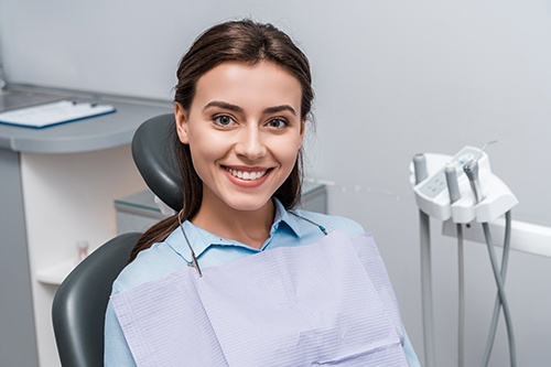 A beautiful woman sitting in a dental clinic