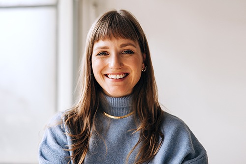 Woman in a sweater smiling