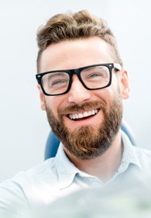 patient smiling in dental chair 