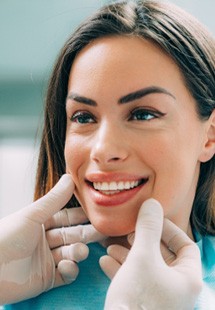 young woman smiling while visiting dentist