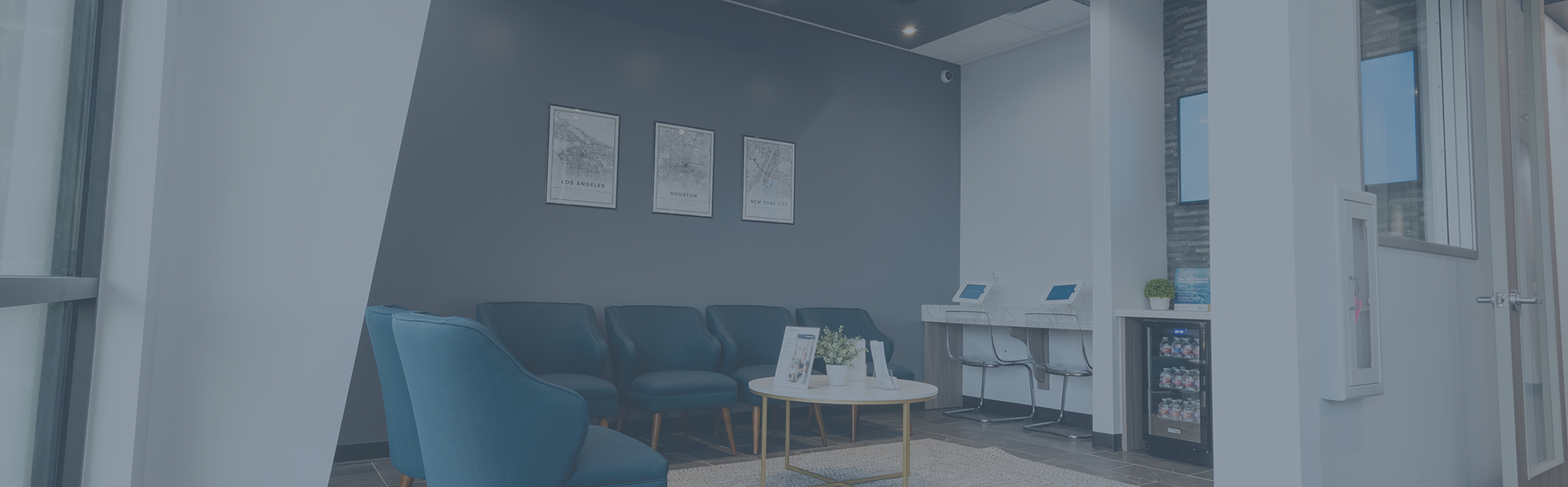 Comfortable-looking blue armchairs in the waiting area at Highline Dental