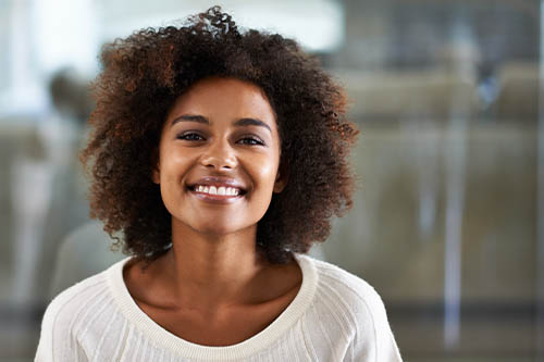 Smiling woman in white sweater